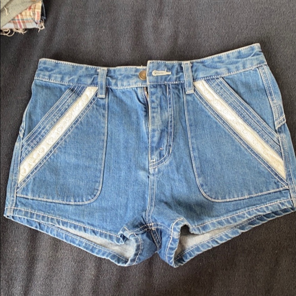 Free People denim shorts with flower lace detail